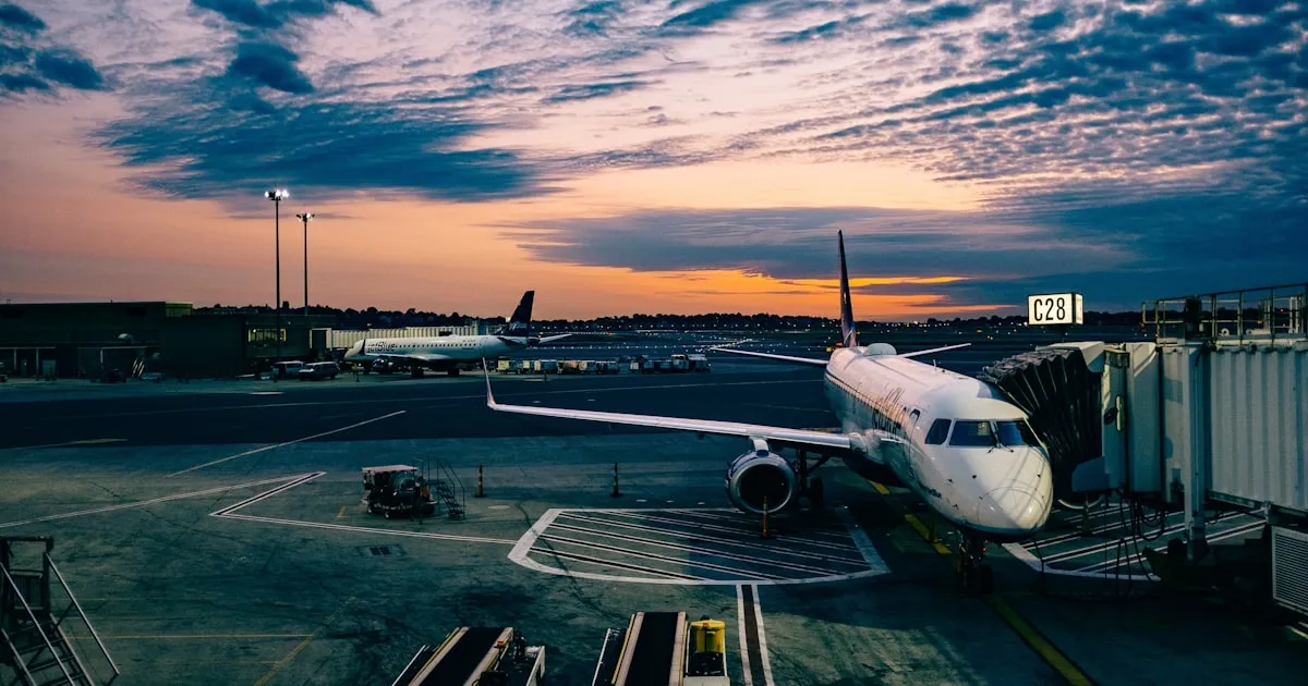 Commercial airplane at sunset on the tarmac